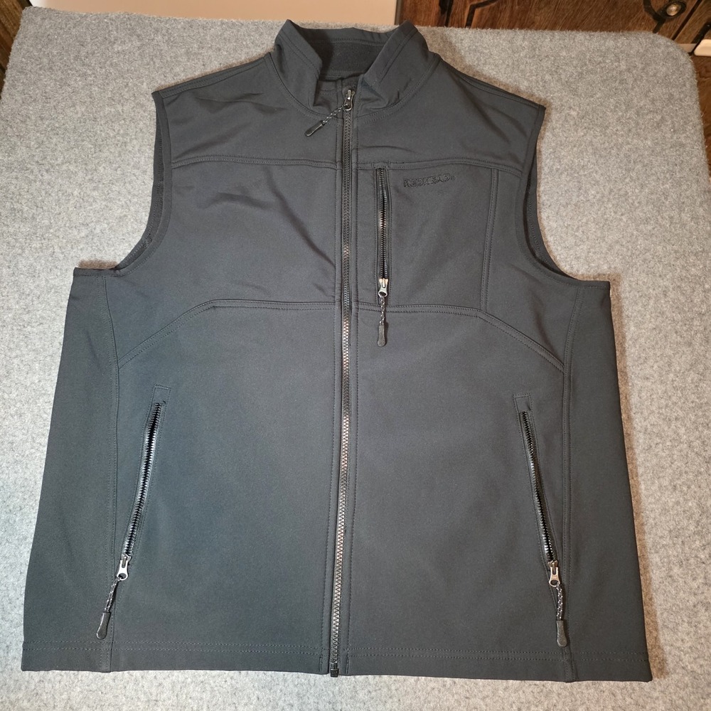 full-zip softshell vest featuring a stand collar and a vertical zippered Lg F2